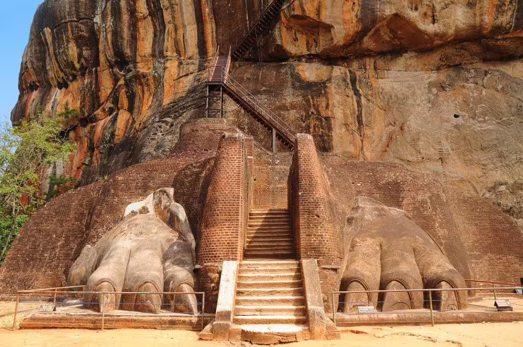 Sigiriya's Lion Rock entrance showcasing ancient carved lion paws in Sri Lanka, a highlight of the private tour.