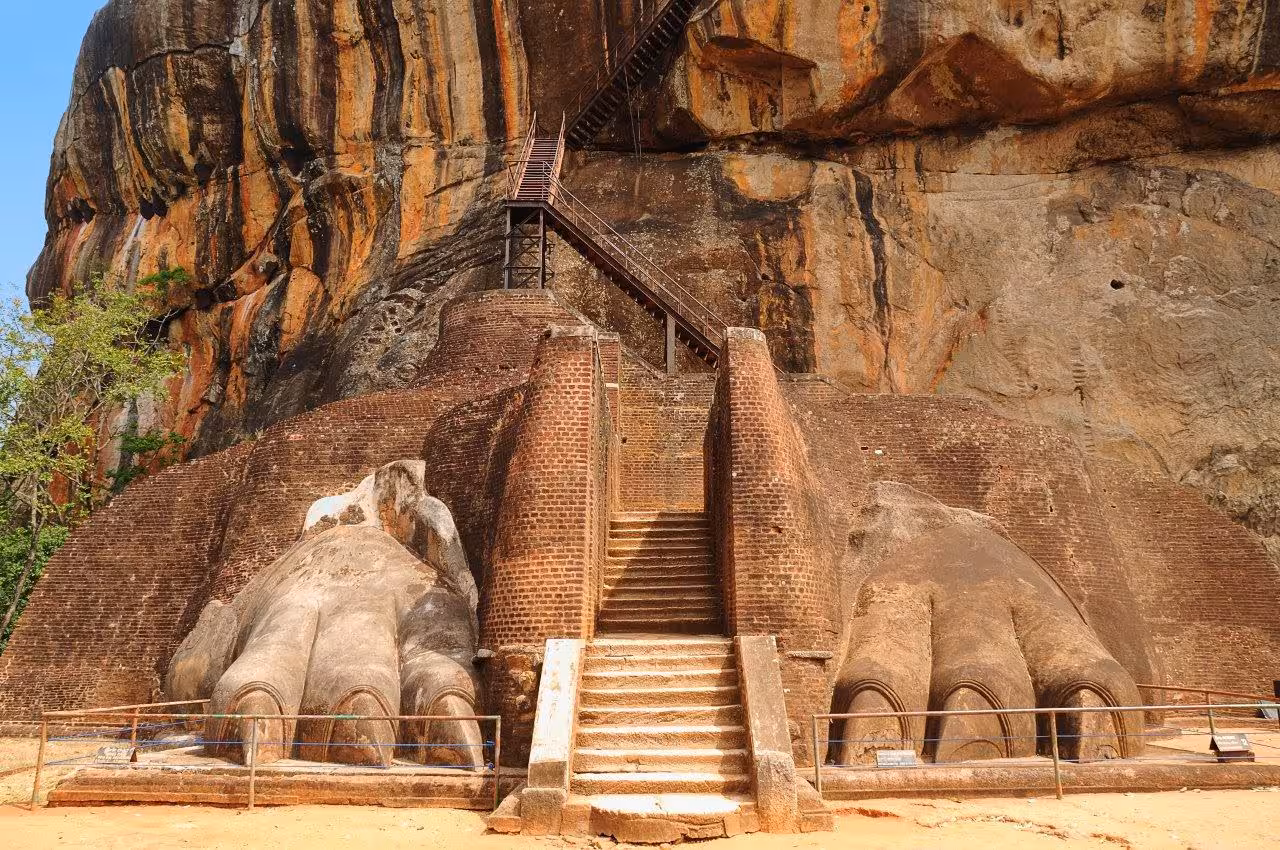 Majestic Sigiriya rock fortress entrance with lion's paws, a must-see historical site in Sri Lanka's cultural tours.