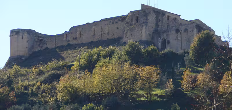 Ancient hilltop fortress near Sila National Park, overlooking green Presila landscapes on a 4 day Calabria tour
