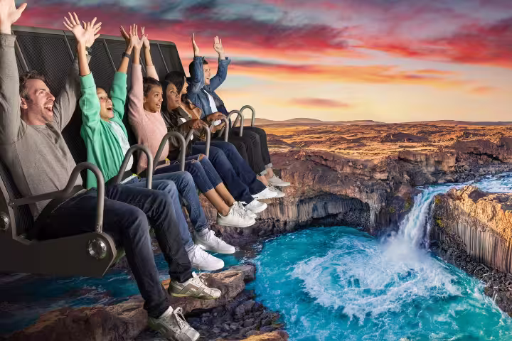 People enjoy an exhilarating virtual ride over Icelandic landscapes at sunset, perfect for Silfra snorkeling tour enthusiasts.