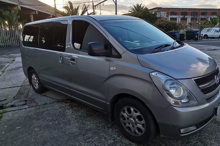 Silver private chauffeur van parked in Cape Town, perfect for full-day tours and convenient transfer services.