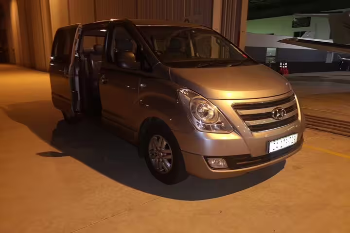 Silver van ready for night-time transfer services in Cape Town, perfect for full day private chauffeur experiences.
