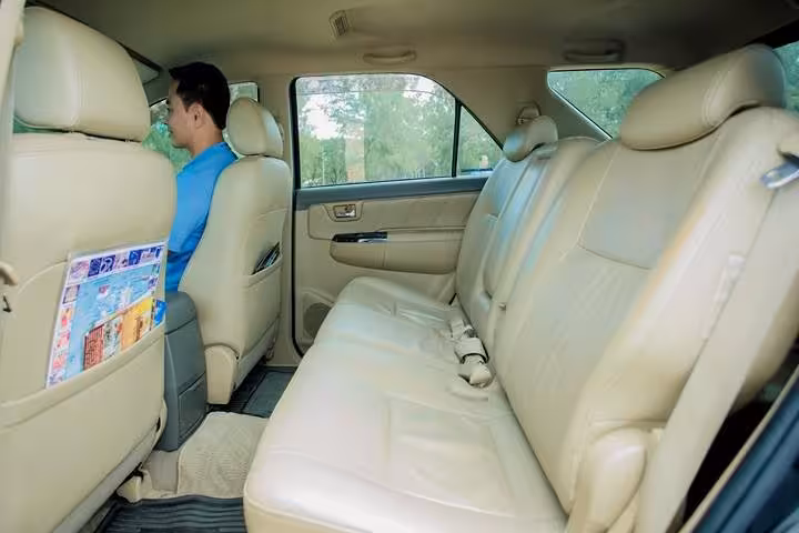 Clean private sedan interior with spacious rear seats for Singapore Changi Airport private transfer to city