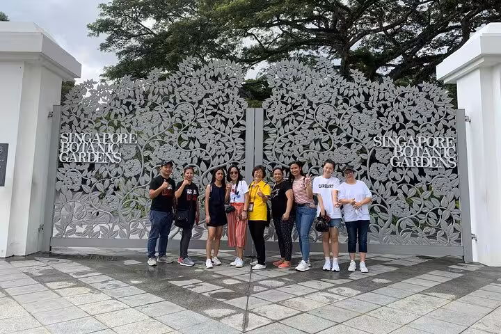Group posing at the entrance of Singapore Botanic Gardens during the Signature Guided Tour with Free eSIM.