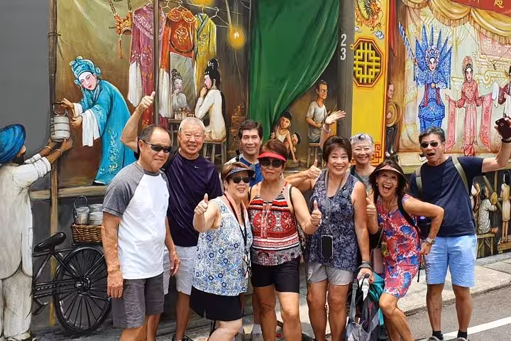 Visitors relaxing at an outdoor concert in Singapore's Botanic Garden.