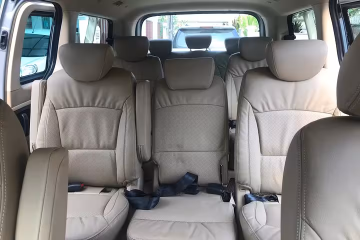 Spacious private MPV interior for Singapore Changi Airport transfer with comfortable leather seats and seatbelts