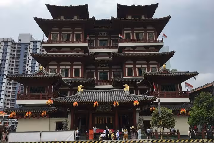 Explore the iconic Buddha Tooth Relic Temple, a cultural landmark on the Singapore Chinatown Local Hawker Food Tour.