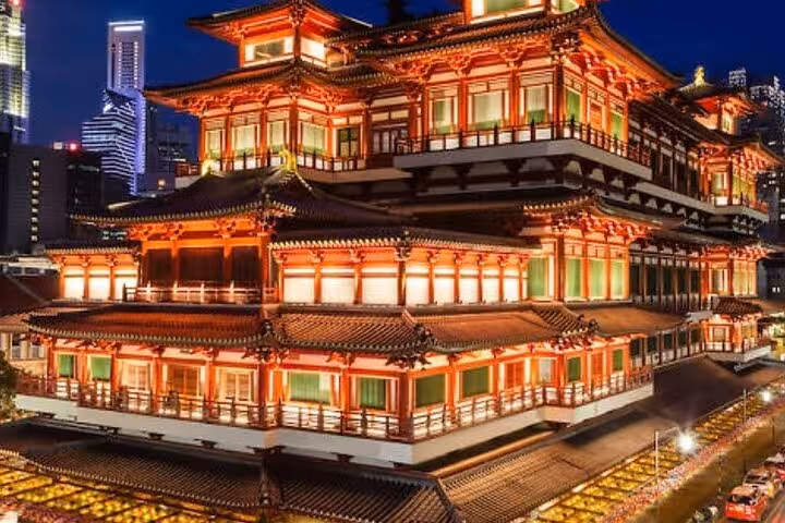 Experience the vibrant architecture of Singapore's Chinatown at night, showcasing traditional Asian design.