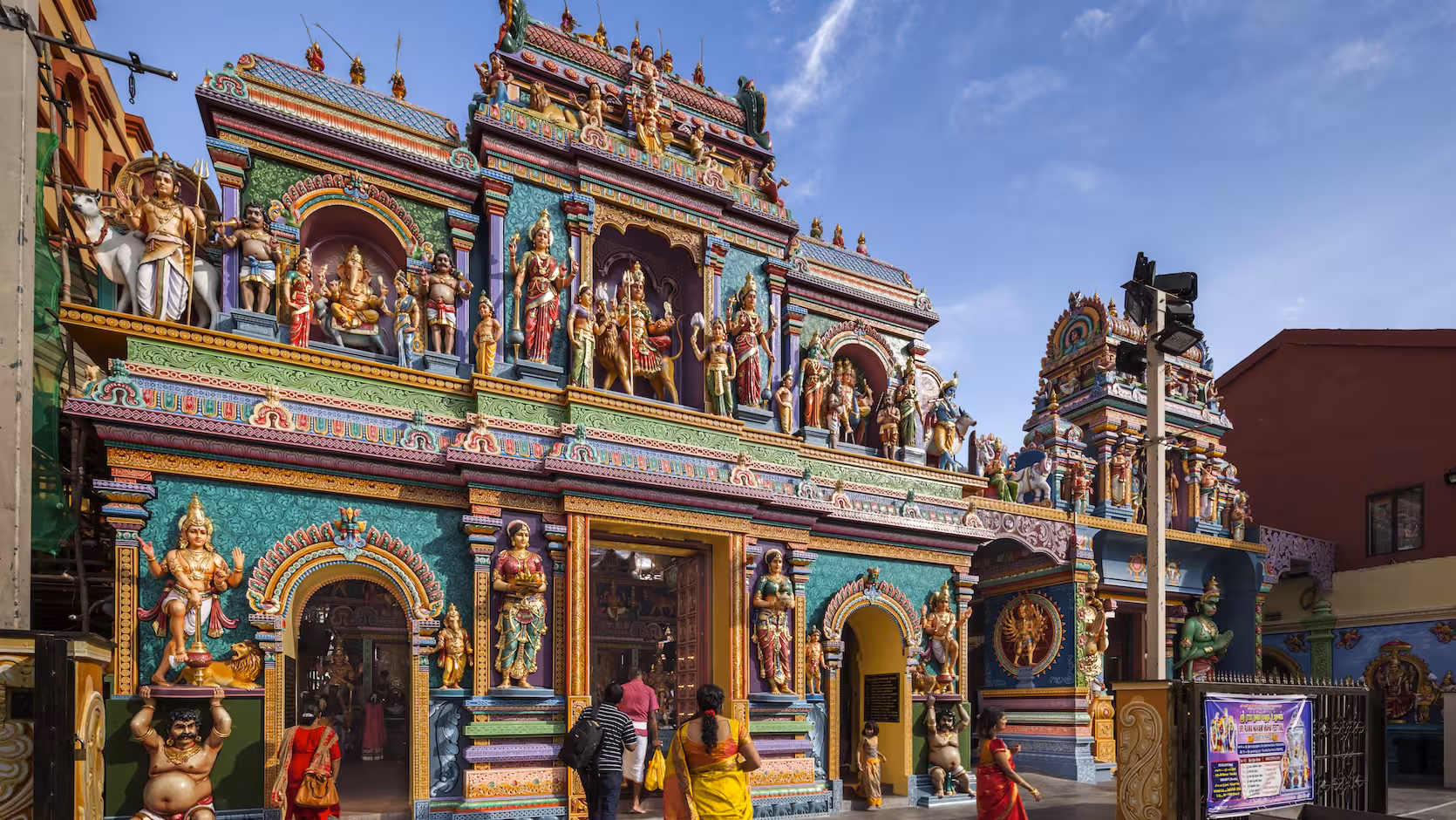 Colorful Hindu temple with intricate statues in Singapore's Little India on the Spice Discovery and Lunch Tour.