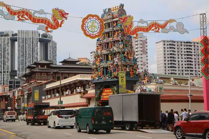 Vibrant Singapore street with colorful temple tower, perfect for exploring on a 3-hour spiritual walking tour.