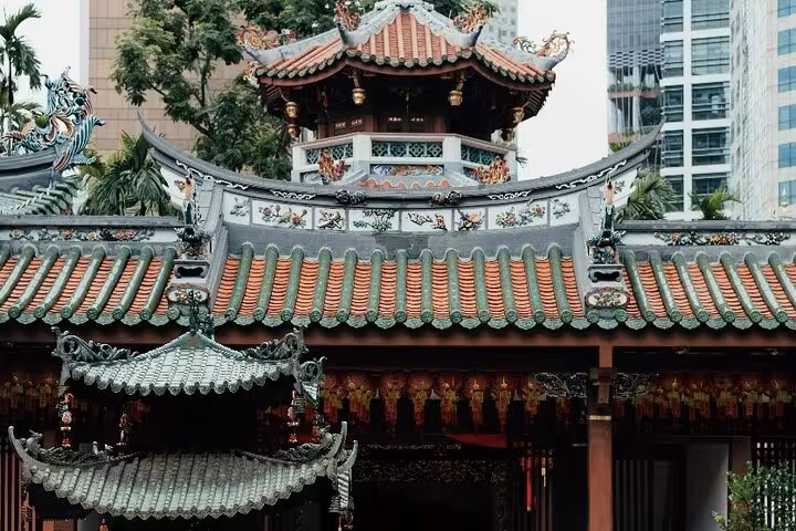 Intricate roof architecture of a spiritual temple in Singapore, highlighting cultural heritage on a walking tour.
