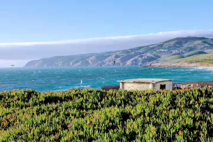 Scenic coastal view of Sintra-Cascais Natural Park with lush greenery and ocean waves, ideal for Sintra World Heritage tours.