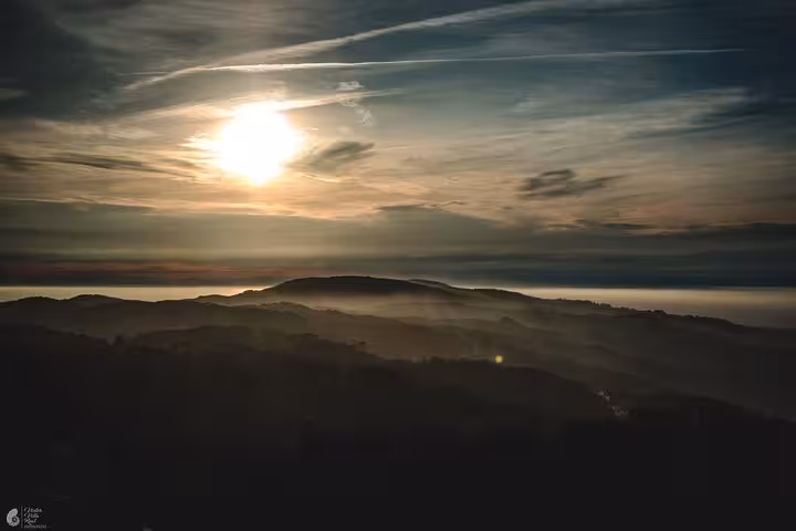 Sunset over Sintra hills and Atlantic haze, scenic viewpoint on a self-drive Sintra monuments and coast tour