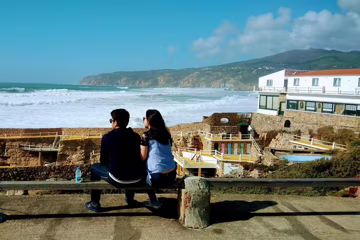 Couple enjoying a scenic ocean view at a coastal village near Sintra, perfect for the Sintra & Amazing Dream Villages Tour.