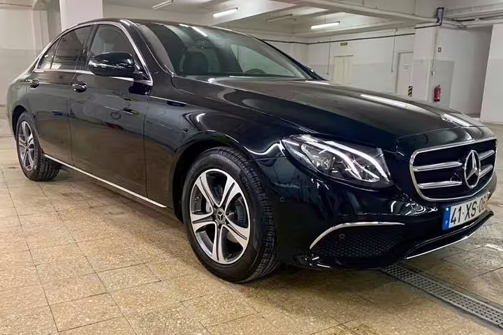 Luxurious black Mercedes-Benz sedan for private Sintra half-day tour, offering comfort and style to UNESCO Heritage sites.