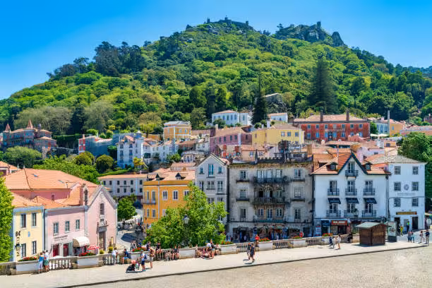 Colorful hillside village of Sintra near Lisbon showcasing charming architecture and lush greenery.