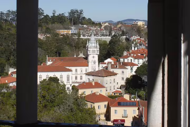 View of Sintra's historic architecture and lush landscape from a balcony, perfect for Lisbon to Sintra palace tours.