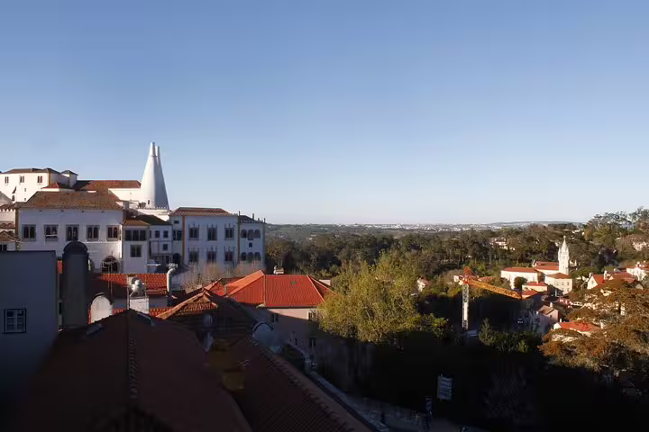 Scenic view of Sintra's historic architecture and lush landscape, highlighting a must-see day trip from Lisbon to Pena Palace and Cabo da Roca.