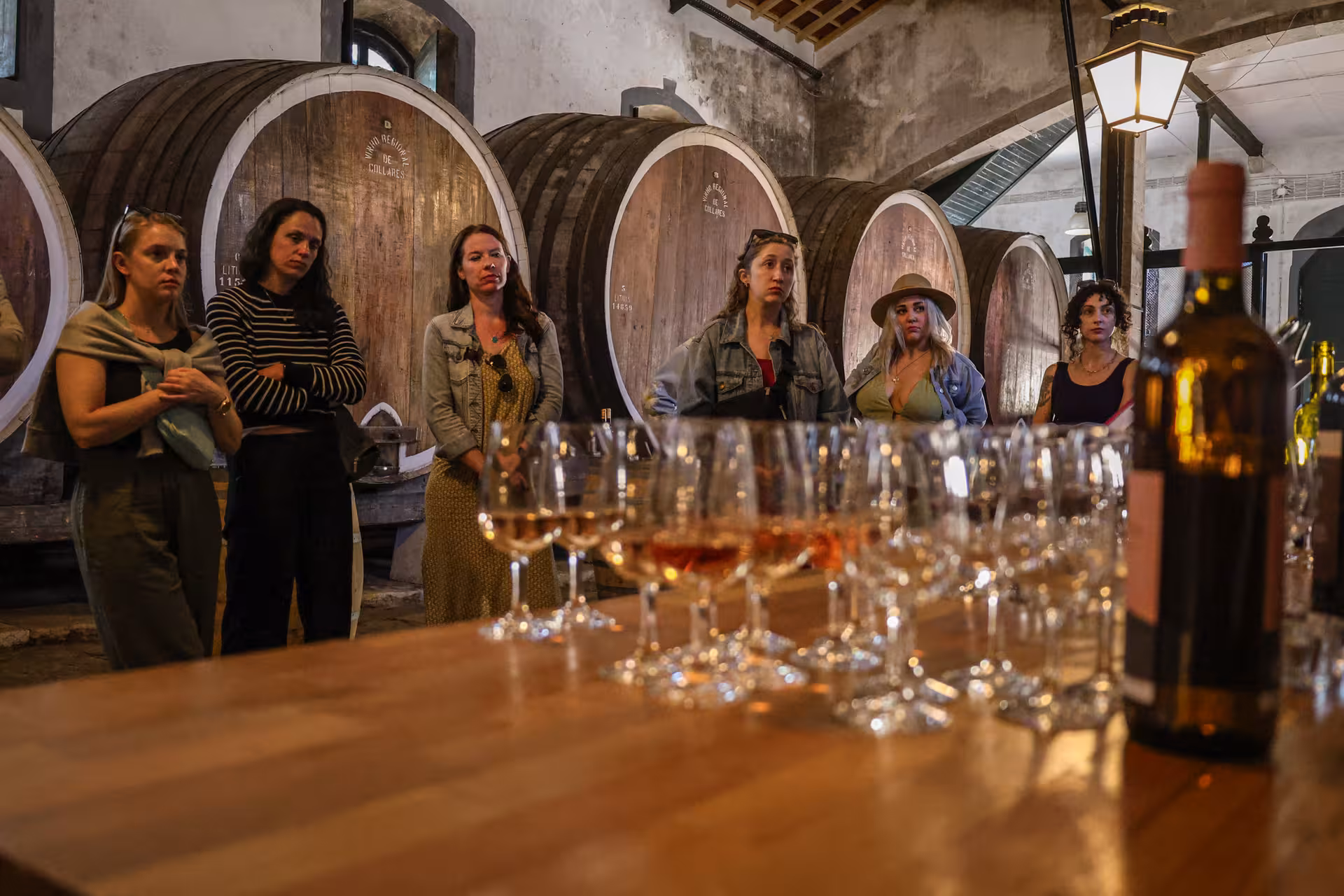 Visitors at a traditional Portuguese winery for a wine tasting session as part of the Sintra and Lisbon tour.