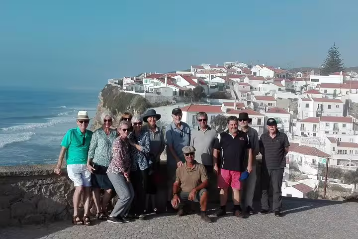 Group enjoying scenic views of coastal village during Sintra, Roca, and Cascais full-day private tour in Portugal.