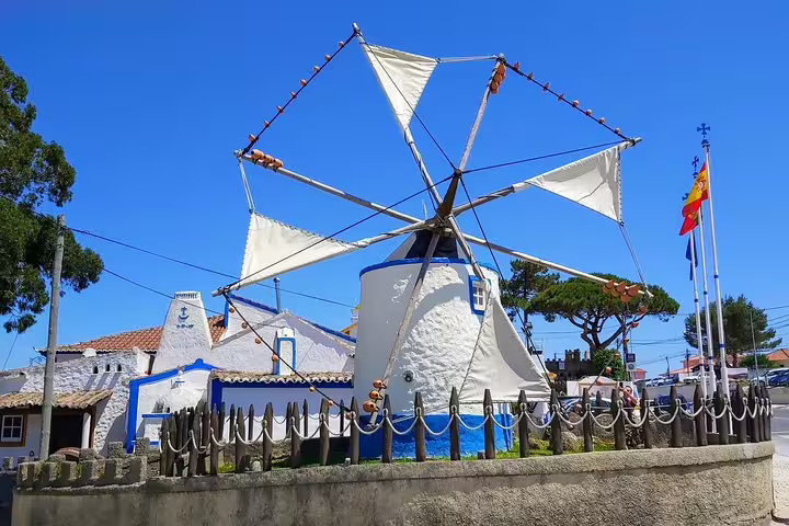 Charming traditional windmill in a picturesque village near Sintra, showcasing Portugal's rich cultural heritage and scenic beauty.