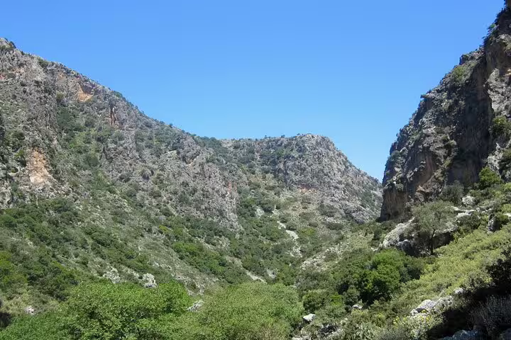 Breathtaking view of Sirikari Gorge's rugged cliffs and lush valleys, ideal for a private hiking tour.