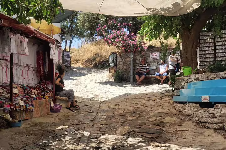 Shaded cobblestone lane with local stalls in Sirince Village, stop on private Ephesus and Artemis tour
