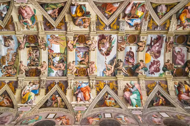 Ceiling frescoes of the Sistine Chapel in the Vatican Museums seen on a guided group tour of Renaissance masterpieces in Rome