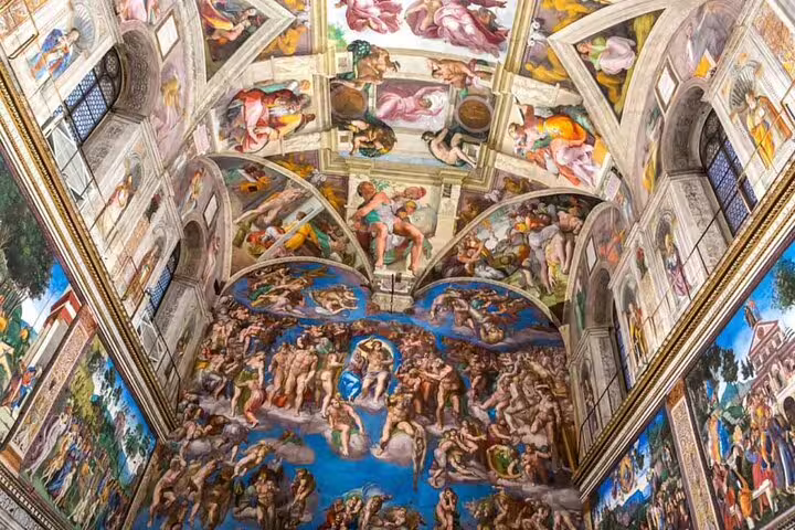 Wide view of Sistine Chapel frescoes and Last Judgment wall on Colosseum and Vatican Museums one day fast track tour