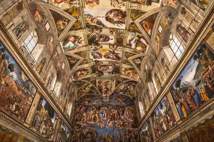 Interior of the Sistine Chapel with Michelangelo’s famous frescoes seen on a Vatican Museums guided group tour in Rome, Italy