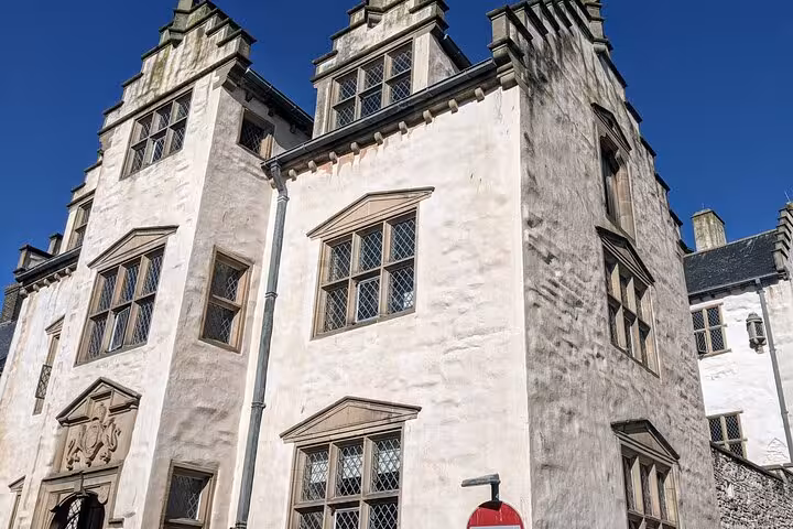 Historic Welsh castle exterior with stone towers, a stop on the Snowdonia & The 3 Castles Tour