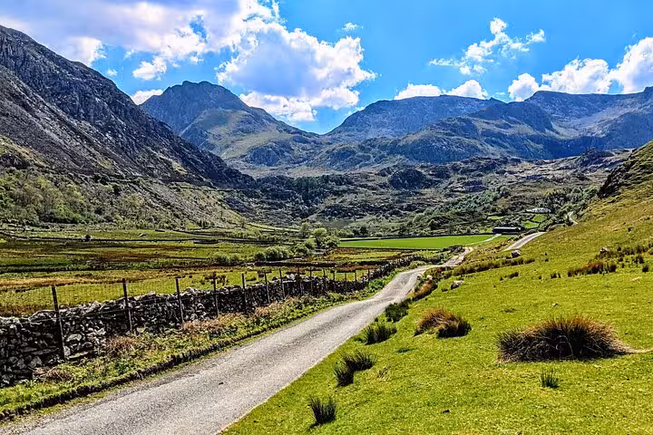 Scenic mountain road through Snowdonia National Park valleys on the Snowdonia & 3 Castles Tour from Wales