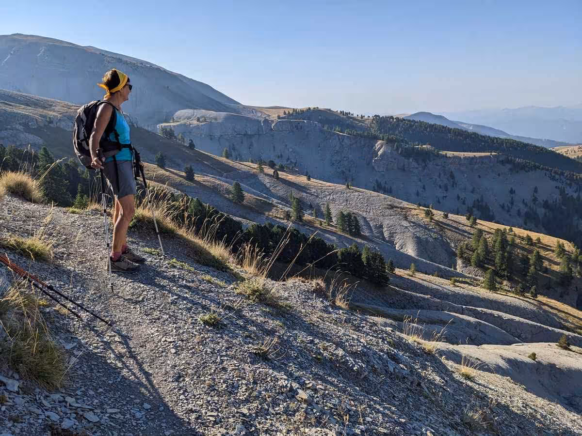 Solo hiker on a ridge above Verdon Gorge, France, showcasing stunning landscapes on the 6-day trek