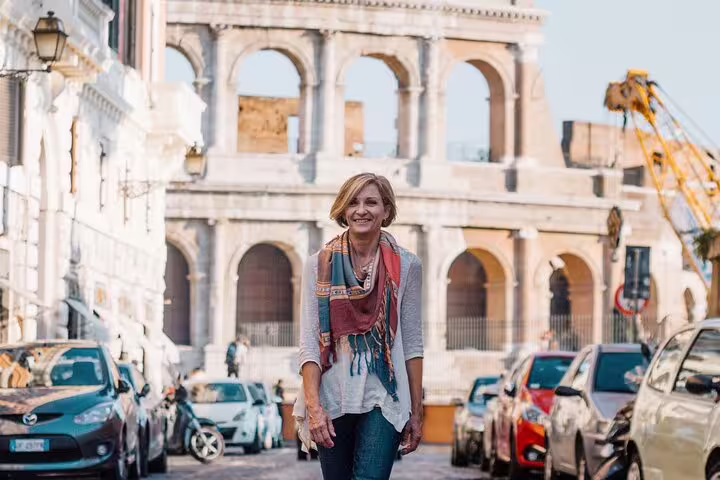 Solo traveler portrait in front of the Colosseum, captured on a private Rome travel photographer session