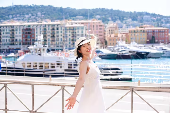 Solo traveler in white dress at Port Hercule marina, Monaco private tour with personal photographer