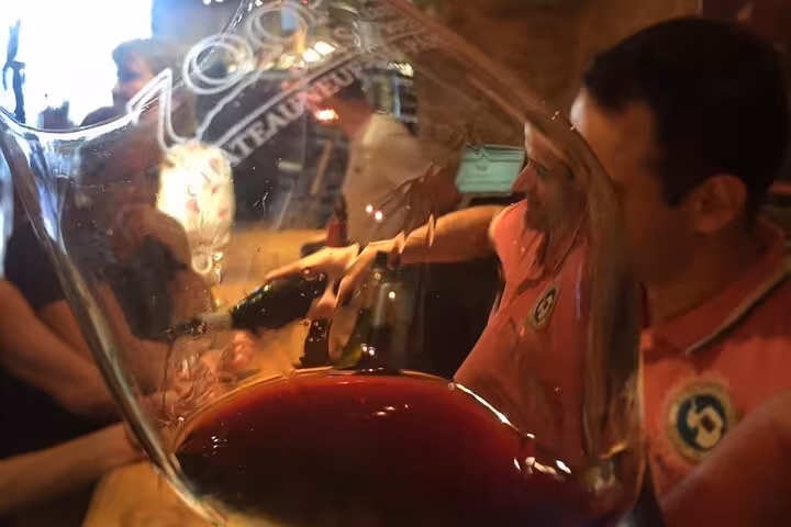 Sommelier course at Pce's Vineyard with red wine tasting in a large glass, paired with food bites