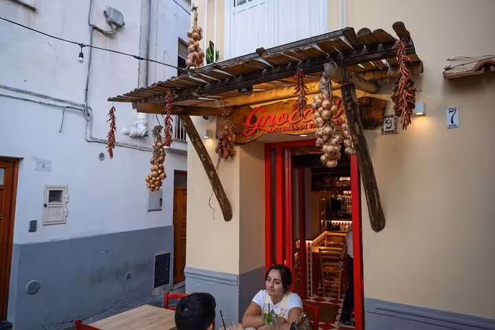 Charming Sorrento cafe with garlic and chili peppers, a stop on the Bites & Sips Tour small group experience.