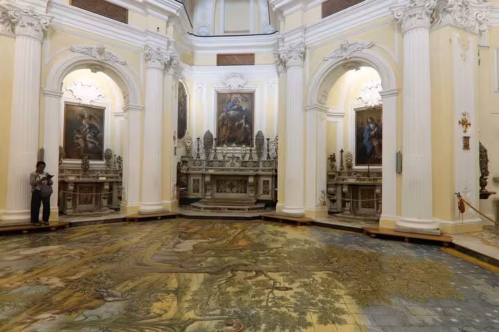 Marvel at the intricate frescoes and grand interiors of a historical site in Anacapri on the Capri tour from Sorrento.