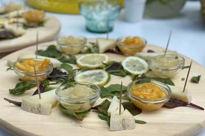 Tasting platter featuring Sorrento lemon jams and cheeses, highlighting authentic local flavors.