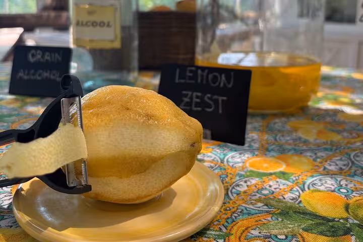 Close-up of lemon zest preparation in a Sorrento grove, highlighting local culinary traditions and flavors.