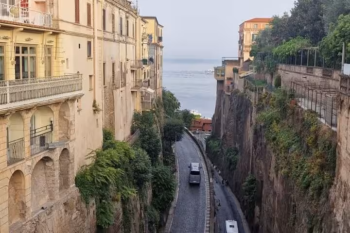 Charming narrow street in Sorrento with coastal view, part of the scenic Amalfi Coast private tour experience.
