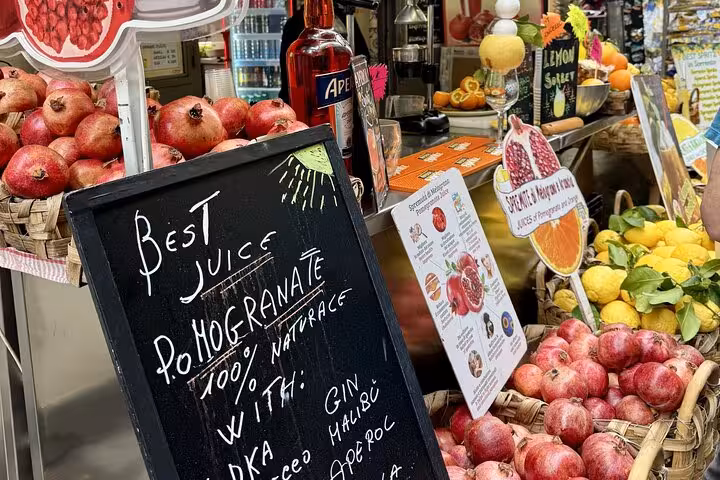 Pomegranate juice bar in Sorrento featuring fresh fruits and cocktail options on the Bites & Sips Tour.