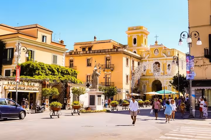 Vibrant street scene in Sorrento with historic architecture and lively atmosphere ideal for exploring from Naples port.