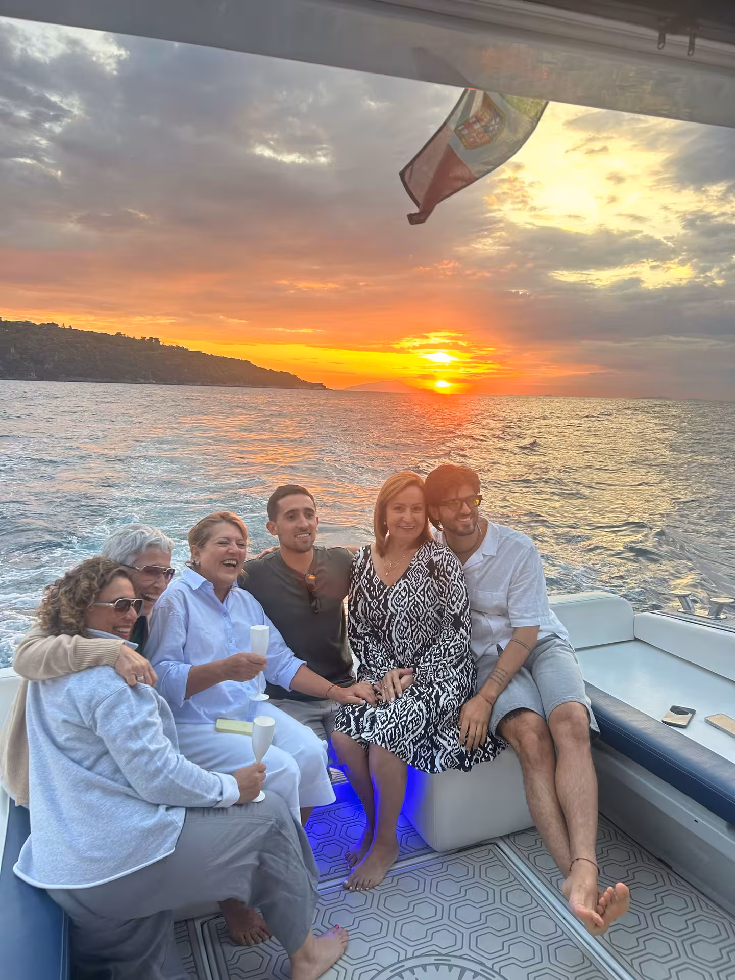 Group enjoying a vibrant sunset on a Sorrento boat tour, capturing the essence of a small group experience.