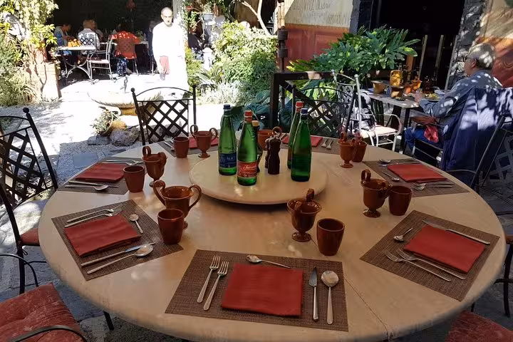 Outdoor terrace table set for Italian lunch in Sorrento, on 6-day private Amalfi Coast and Capri tour