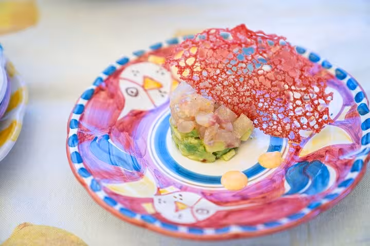 Colorful plate of gourmet appetizers with artistic presentation, highlighting the Sorrento wine pairing lunch event.