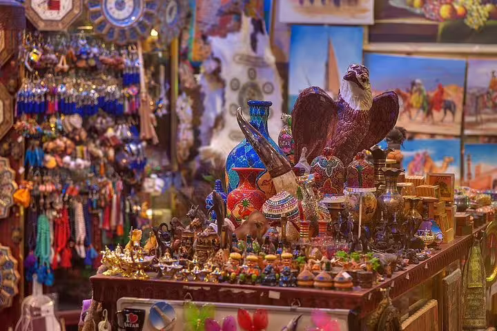 Vibrant collection of traditional Qatari souvenirs at Souq Waqif in Doha, featuring colorful pottery and ornaments.