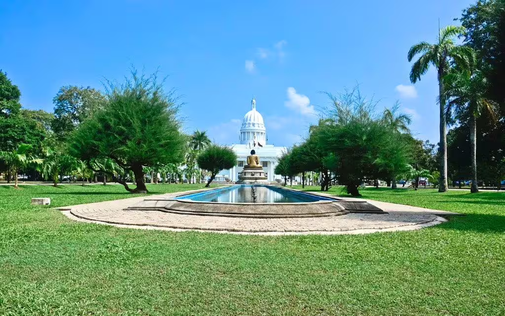Majestic white dome and fountain in lush park setting on Southern Coast Beach Tour, perfect for cultural exploration.
