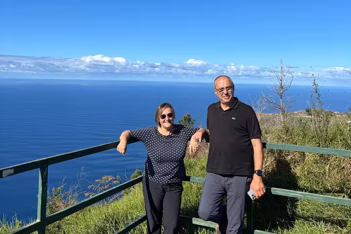 Couple at a southwest Madeira coastal viewpoint during a cultural and geological 4x4 adventure tour