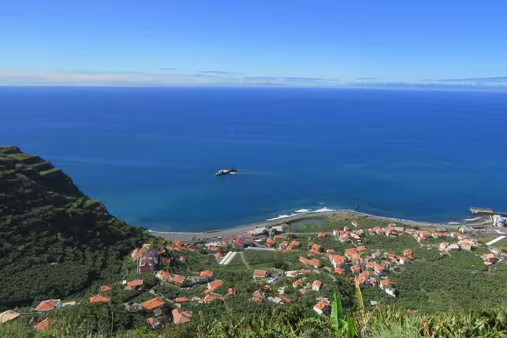 Aerial view of the stunning southwest Madeira coastline, featuring lush greenery and ocean vistas, ideal for a 4x4 guided exploration tour.